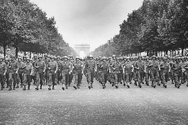 A large group of people marching Description automatically generated with medium confidence