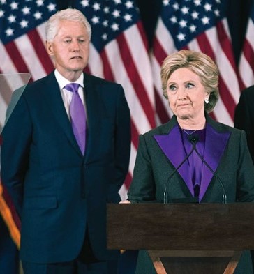 Two people standing at a podium in front of flags Description automatically generated with medium confidence