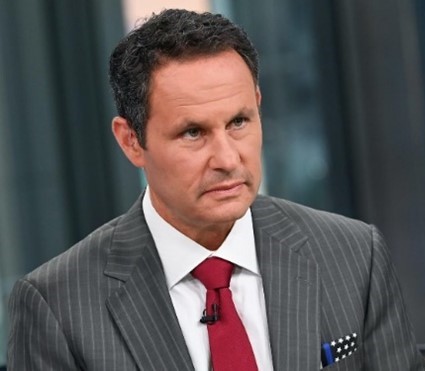 A person in a suit and tie Description automatically generated