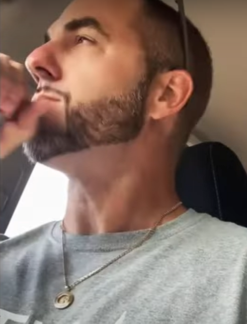 A person with a beard Description automatically generated