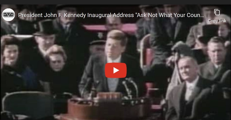 A person sitting at a podium Description automatically generated